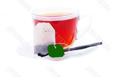 Cup of green tea with vanilla on white background