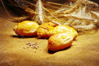 Vintage Styled still-life with cruissant and wheat ears 
