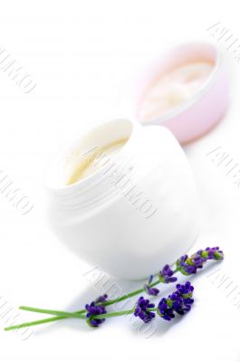 Closeup of open container of cosmetic face cream 