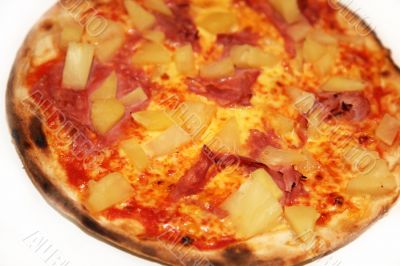 Delicious pizza - pineapple, ham, salami 