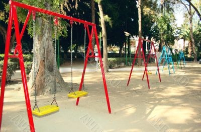 Swing chairs in playing garden