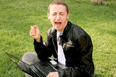 Crying boy with laptop