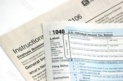 Hand signing a tax form concept of filing tax