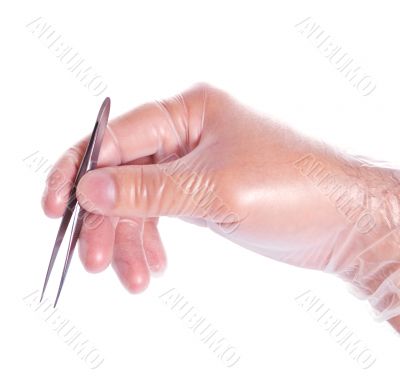 hand in rubber glove holding tweezers