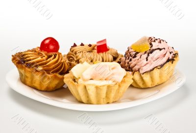 cakes on white dish cakes on white dish