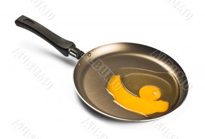 raw egg on black pan