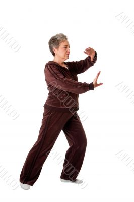 Senior woman doing Tai Chi Yoga exercise