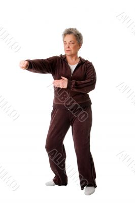 Senior woman doing Tai Chi Yoga exercise