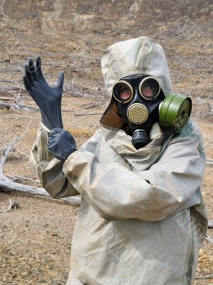 Gas mask, gloves, the person