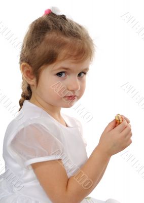 The girl eats cookies