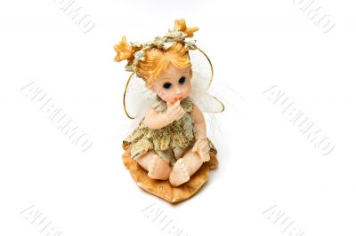 Souvenir figure of the little fairy. Isolated on a white backgro