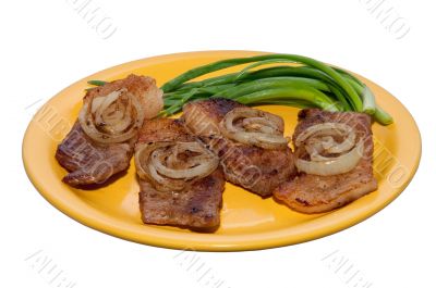 juicy steak with onions on a plate 