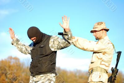 soldier aiming terrorist