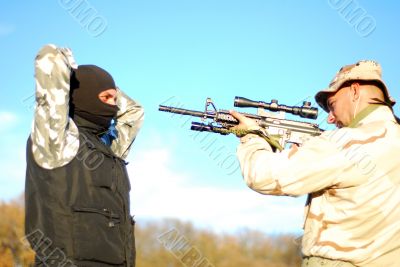 soldier aiming terrorist