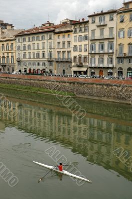 Kayaker on River Arno in Florence, Italy