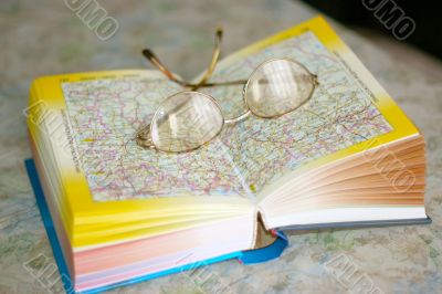 spectacles on page geographical atlas