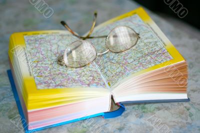 spectacles on page geographical atlas