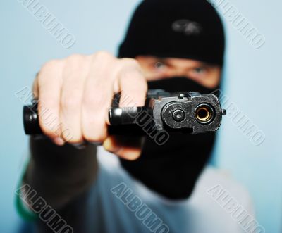 man with a gun on his hand