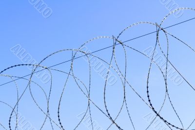 barbed wire against the sky