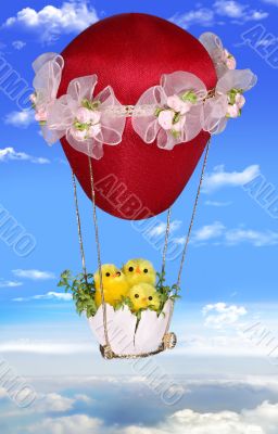 Three Easter chickens on a balloon