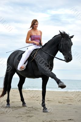 girl and  horse on the beach