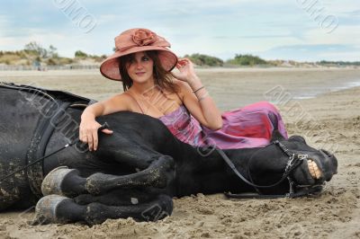 girl and  horse on the beach