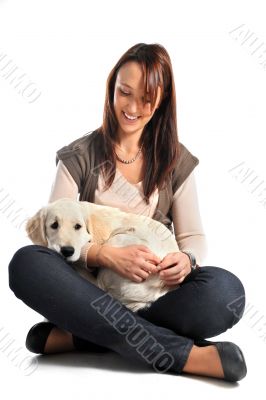 puppy golden retriever and woman