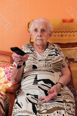 senior woman and remote control