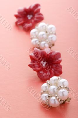 costume jewel earrings on red