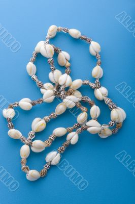 costume jewellery beads on blue