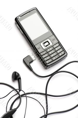 mobile phone with head set close up mobile phone with head set close up
