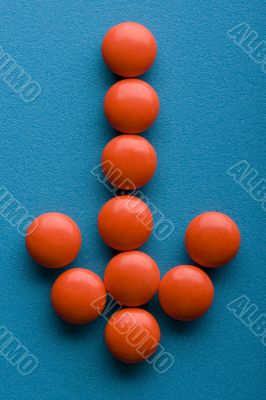 Red Tablets on blue background Red Tablets on blue background