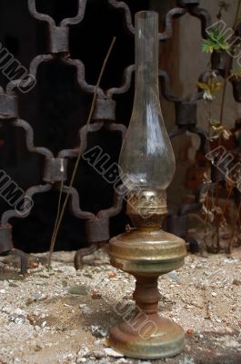 Betty Lamp in the Grilled Window Background