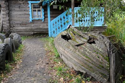 Old Shabby Boat and the House