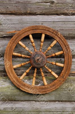 Spinning Wheel On The Blockhouse Wall Spinning Wheel On The Blockhouse Wall