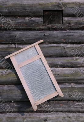 Washboard on Old Log House Wall