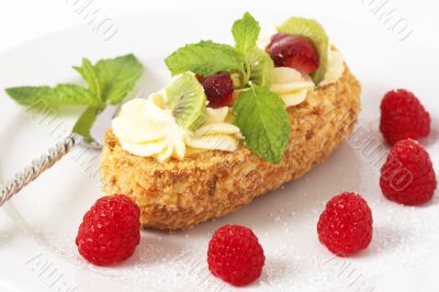 Fruit boat cake with raspberries
