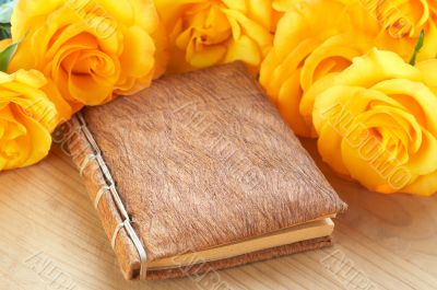 Yellow roses on a book