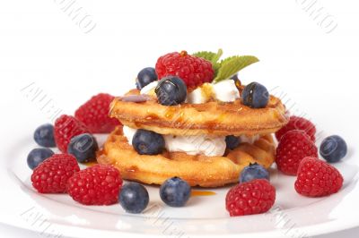 Belgian waffles with berries and cream