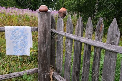Clay Pots and Towel on the Fence