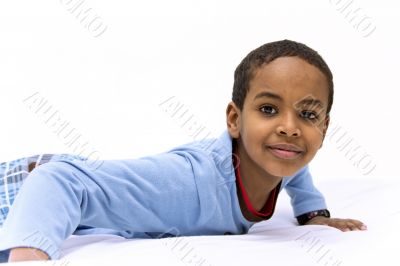 Portrait of a young boy raising his head