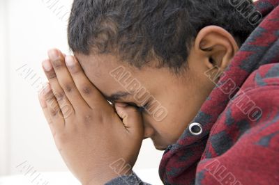 A Young kid praying