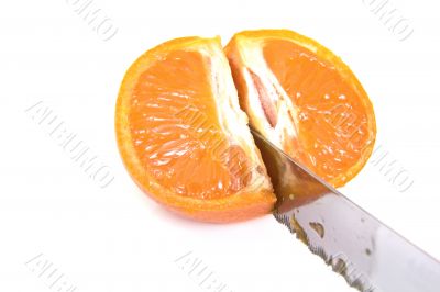 Mandarin orange cut with a knife