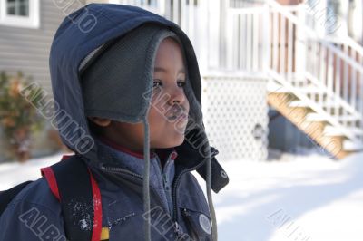 Young kid out in the cold