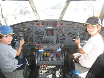 two boys in a cockpit
