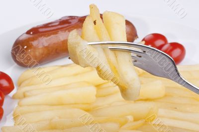 Fried potato on a fork Fried potato on a fork