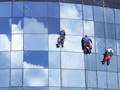 Workers washing a skyscraper windows