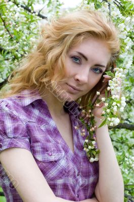 Red-headed womn under cherry tree