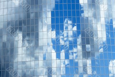 Sky reflected in skyscrapers windows