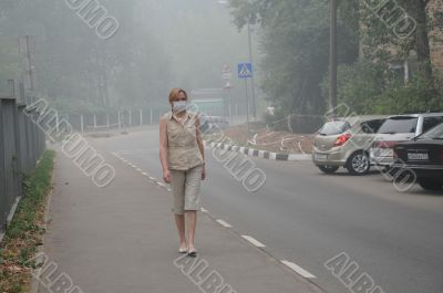 Woman Walking in Thick Smog Woman Walking in Thick Smog